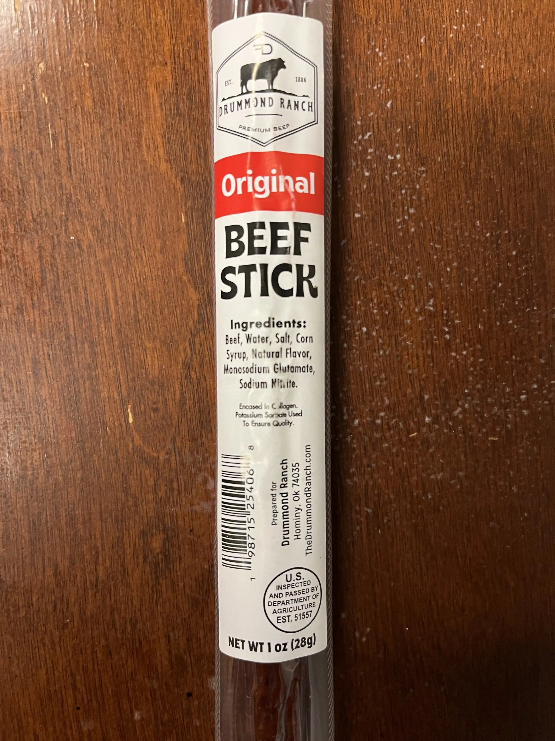 Close-up of an Original flavor beef stick from Drummond Ranch in its packaging, clearly displaying the ingredients and product information.